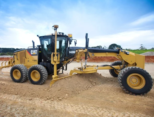GPS-equipped Caterpillar 140M AWD motor grader available for wet hire with operator in Sydney