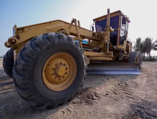 Motor grader completing farm levelling on open rural land