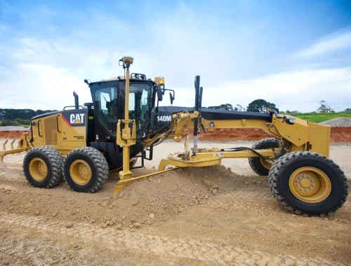 GPS-equipped Caterpillar 140M AWD motor grader available for wet hire with operator in Sydney